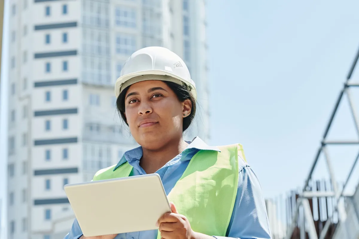 Site supervisor checking a project timeline on a tablet